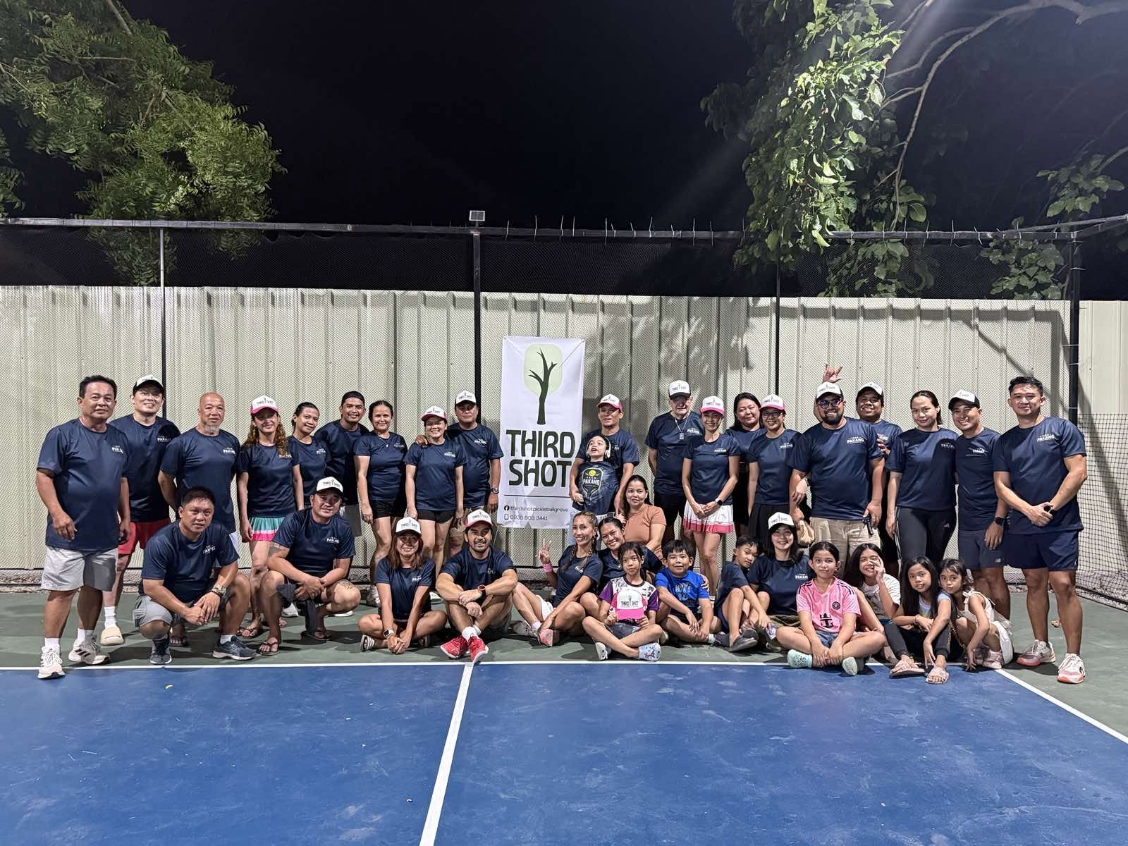 Doubles play under the lights at Third Shot Pickleball Grove